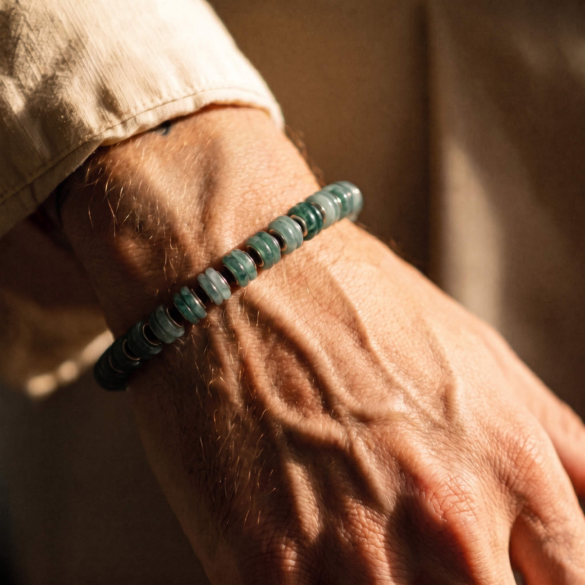 Guatemalan Jade Bracelet I with blue-green jade beads, hematite spacers and a sterling silver clasp