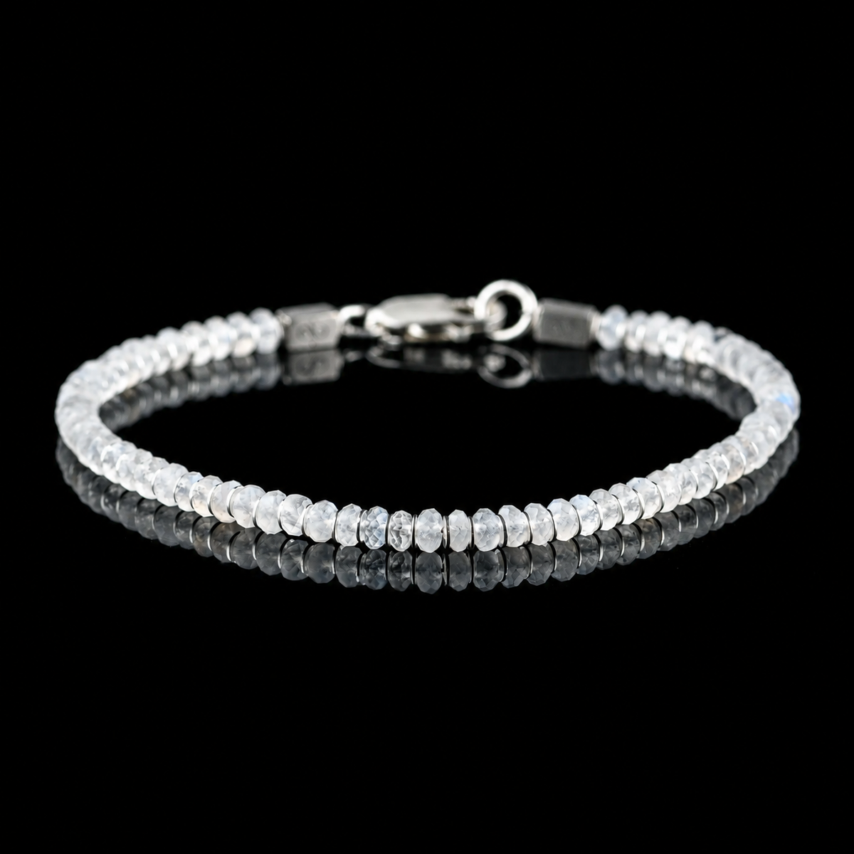 Front view of Moonstone Bracelet X (4mm), showing the complete bracelet on a black reflective surface.