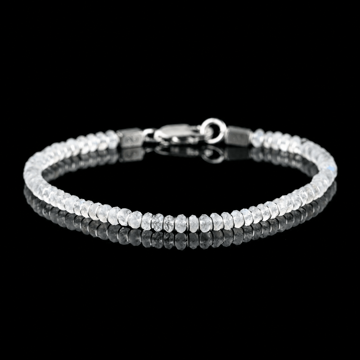 Front view of Moonstone Bracelet X (4mm), showing the complete bracelet on a black reflective surface.