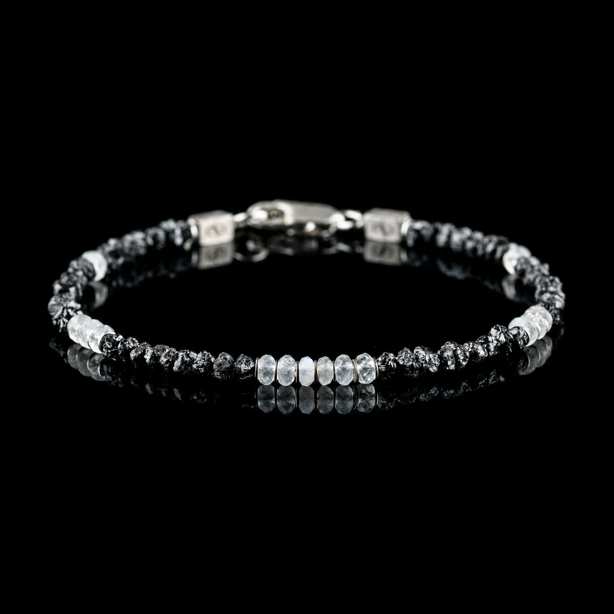Front view of Raw Black Diamond - Moonstone Bracelet I (3-4mm), showing the complete bracelet on a black reflective surface.