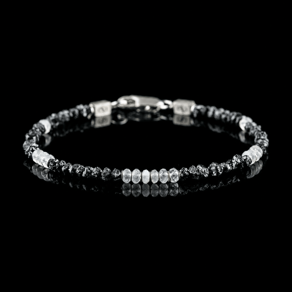 Front view of Raw Black Diamond - Moonstone Bracelet I (3-4mm), showing the complete bracelet on a black reflective surface.